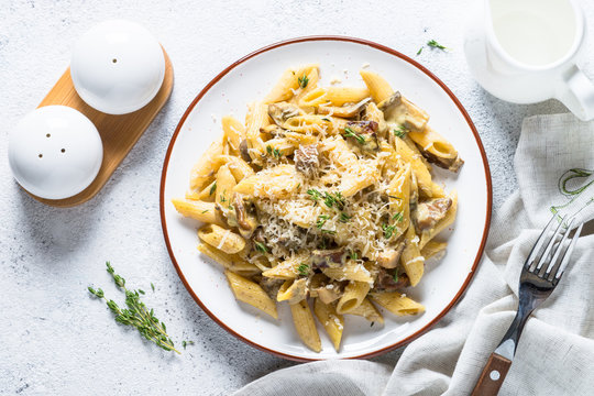 Pasta With White Mushrooms In Creamy Sauce.