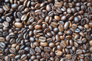 Background of aromatic roasted coffee beans used for decorating packages covers banners flyers leaflets.