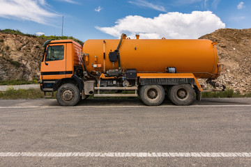 Fototapeta na wymiar Truck with water tank intended for construction