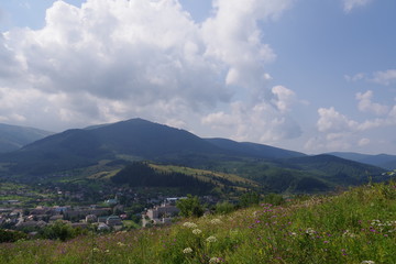 Naklejka premium mountain slopes green trees and mountains