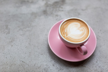 Cappuccino on a concrete surface