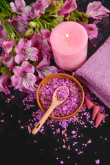 Spa background-towel, orchid, and spoon ,petals in bowl, salt in spoon