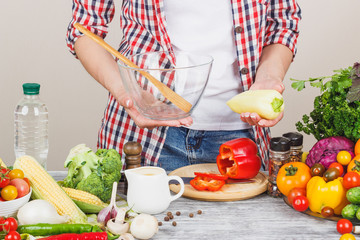 Woman cooks at the kitchen