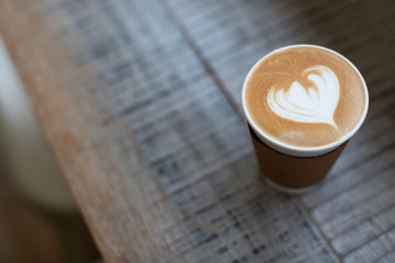 Coffee in take out cup on the table