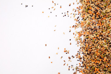 Top view close up of a different beans and seeds on a white background