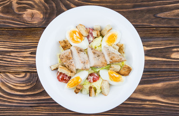 Caesar salad with chicken, top view