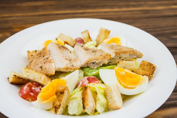 Caesar salad with chicken, close-up