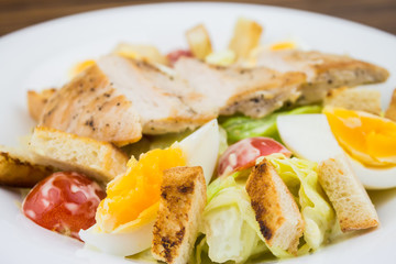 Caesar salad with chicken, close-up