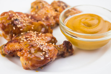 chicken wings and mustard sauce, close-up