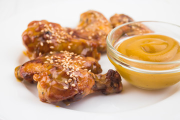 chicken wings and mustard sauce, close-up