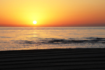 Sunrise on the beach. © AnNushka