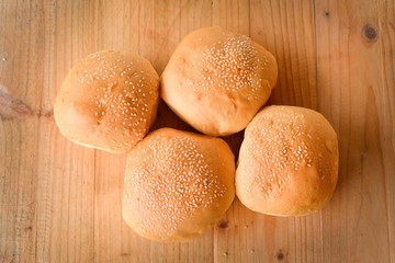 Burger buns on wooden table. selective focus
