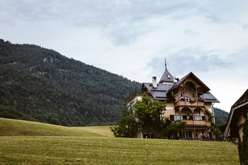 Fototapeta na wymiar Old house in front of a mountain in austria