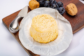 French Langres soft cows crumbly cheese with washed rind structure made in Champagne - Ardenne region