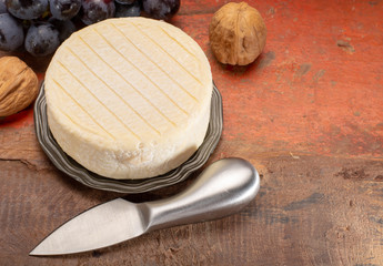 Munster of Pied Angloys, moist, soft, creamy with strong taste, surface-ripened cow's milk cheese made in  France.