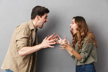 Portrait of an angry young couple having an argument - obrazy, fototapety, plakaty