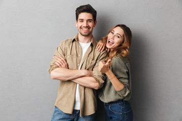 Portrait of a cheerful young couple standing together - Powered by Adobe