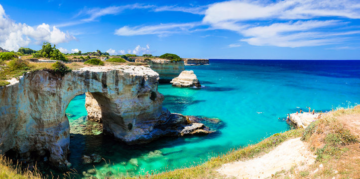 Torre Sant Andrea Puglia sea stacks high resolution 9k panorama near Otranto Italy. Scenic view of Faraglioni di Sant Andrea with turquoise water in Salento. Adriatic coast volcanic rock arch 