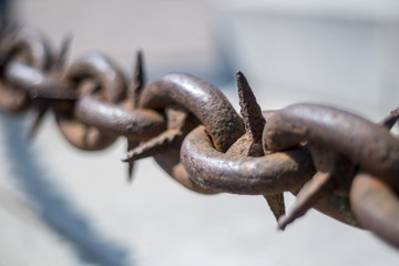 Spiky rusted chain