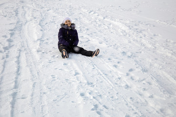 Fototapeta na wymiar young girl on sledge