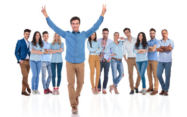 Fototapeta premium young team leader celebrating success of group whil walking forward