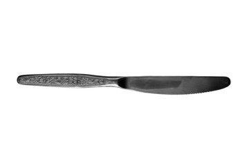 Metallic knife of silvery color on a white background.