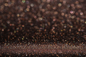 Abstract dark orange brown sparkling glitter wall and floor perspective background studio with blur bokeh.luxury holiday backdrop mock up for display of product.holiday festive greeting card