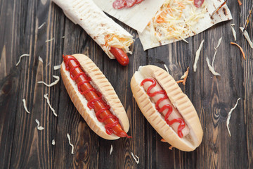 fast food.hot dogs with sauce on wooden background