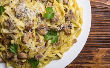 Pasta tagliatelle with chicken meat and mushroom
