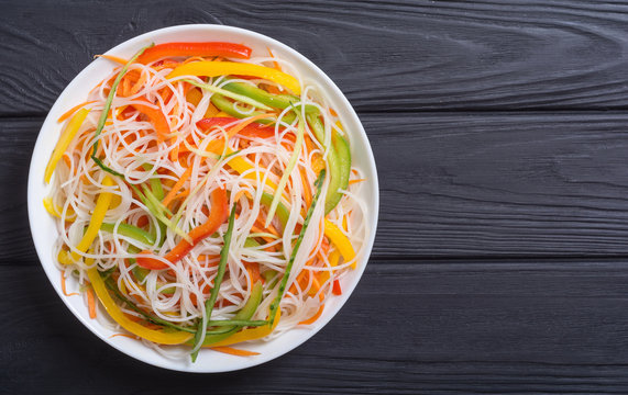Salad from rice noodles with vegetables