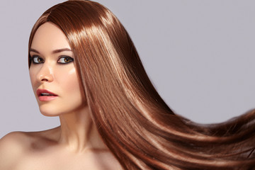 Fashion Model Woman with Beautiful Long Blowing Hair. Glamour Sexy Woman with Healthy and Beauty Flying Brown Hair