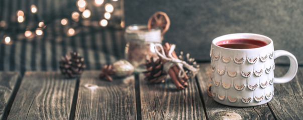 mulled wine in a cup on a wooden background