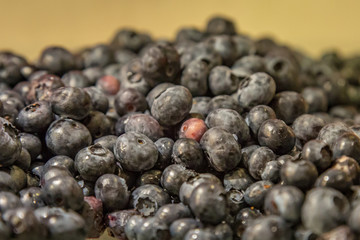 A pile of blueberries on a plate