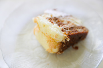 Fresh chocolate vanilla cake on white plate