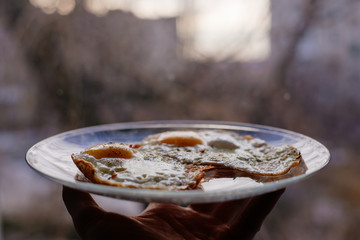 Fried eggs for breakfast early in the morning. Scrambled eggs with spices.