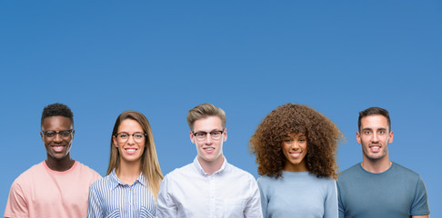 Composition of group of friends over blue blackground with a happy and cool smile on face. Lucky person.