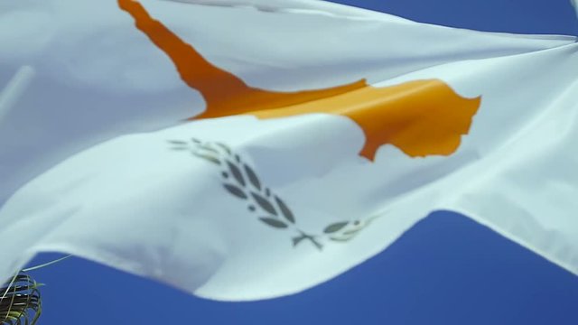 Cyprus flag waving at wind with blue sky