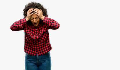 Beautiful arab woman stressful keeping hands on head, terrified in panic, shouting