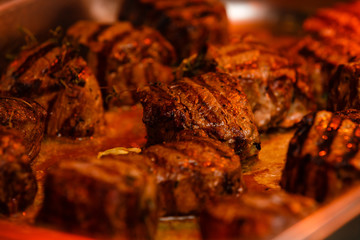 Searing beef bottom round roast cubes in cast iron skillet , closeup