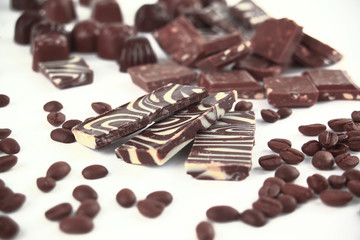close up.set of chocolate bars and coffee beans. isolated on whi