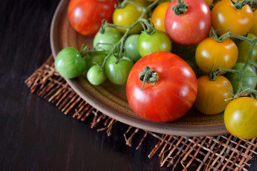 Tomatoes of different sorts and colours on a plate