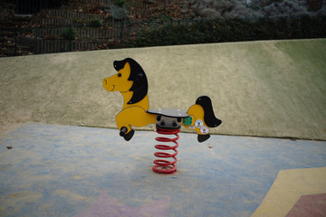 Playground fun toy horse in playground - recreation