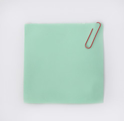 paper clip on blank sheets for notes isolated on white background