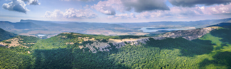 360 panorama aerial view of valley with lake among mountains in summer