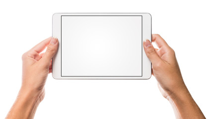 Hands holding tablet with blank screen and white background