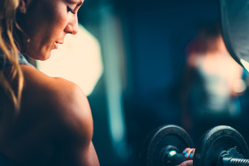 Fototapeta na wymiar Sporty woman exercising in the gym
