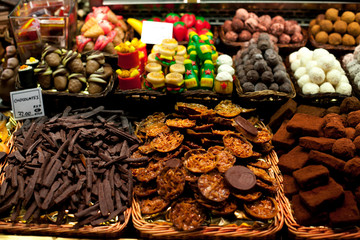 Famous sweet candy market .Confectionery at Boqueria market place in Barcelona, Spain. Assorted...