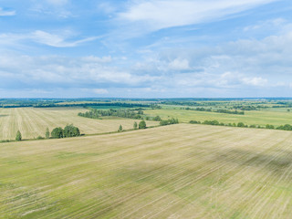 Aerial view of the field with shadows from the clouds  