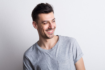 Portrait of a young man in a studio. Copy space.