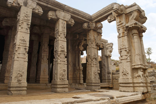 Carved pillars of the Kalyana Mandapa, Divine Marriage Hall, Achyuta Raya temple, Hampi, Karnataka, India. Sacred Center. General view from the south.